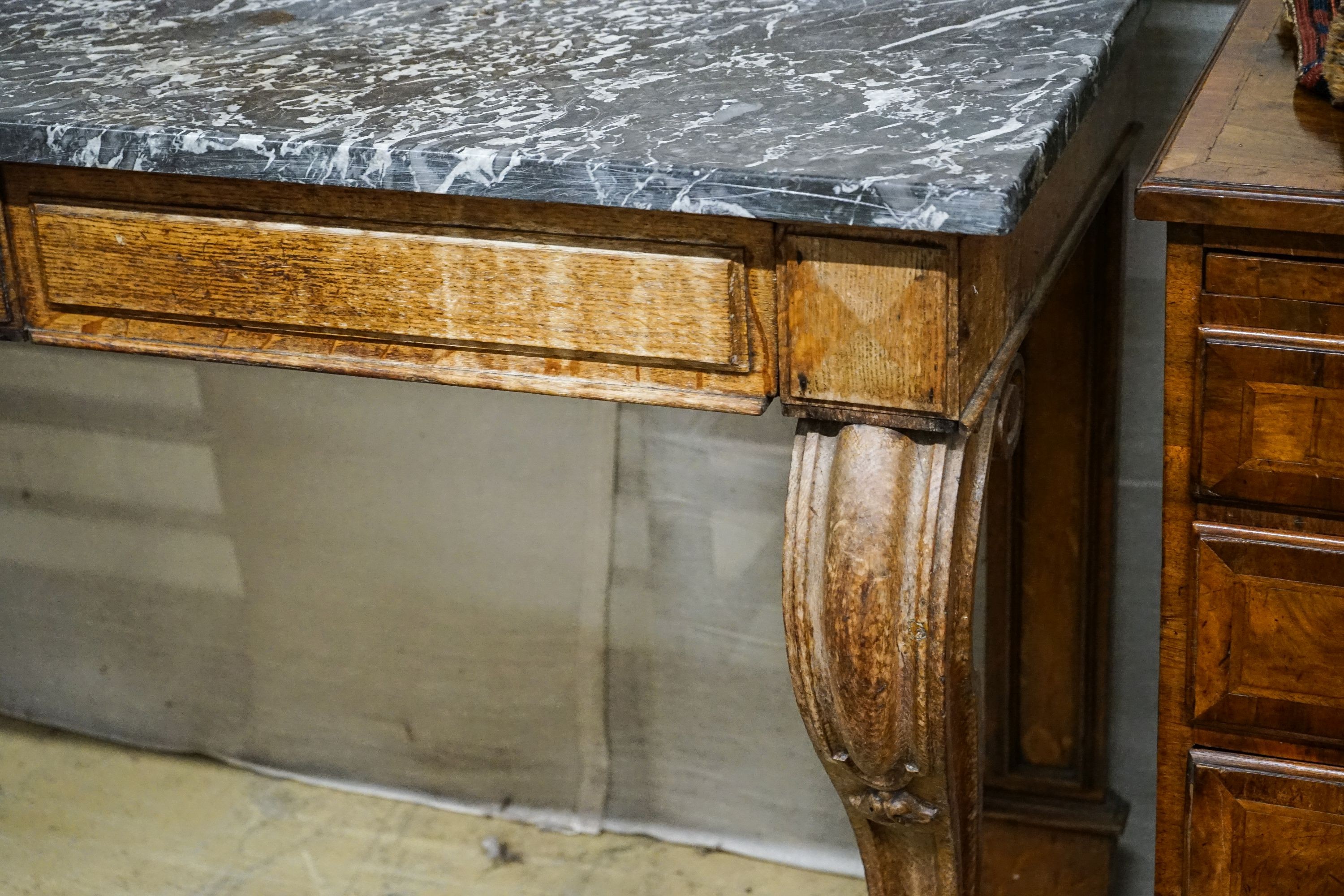 A mid Victorian oak marble topped two drawer console table, width 138cm, depth 54cm, height 120cm